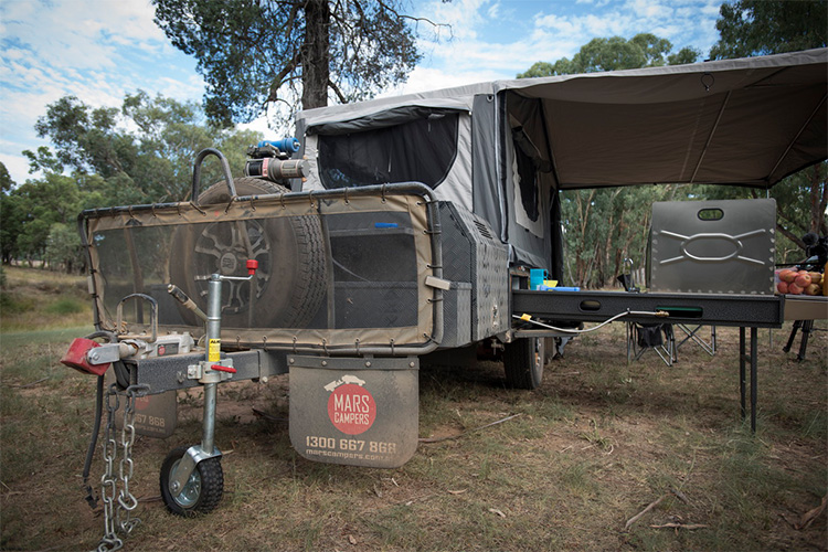 Rear folding camper trailer setup