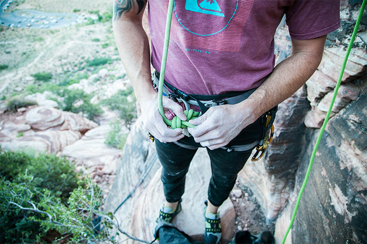 Person gearing up for rock climbing
