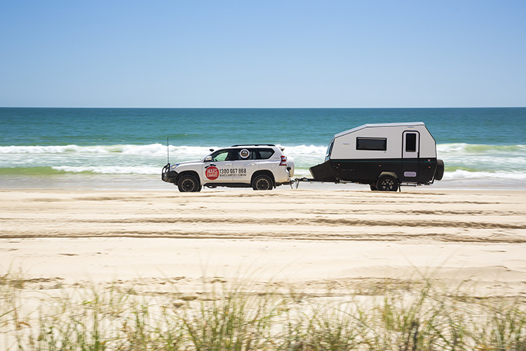Camper Trailer with beach in the background