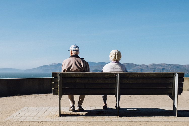 Old Couple sitting in sun