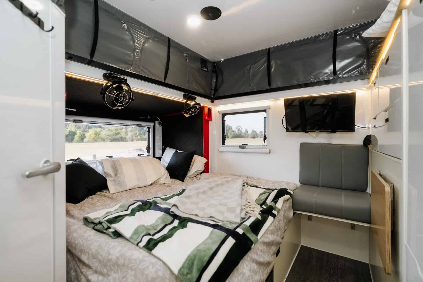 Mars 11S offroad hybrid caravan interior internal living area with set up bed jpg