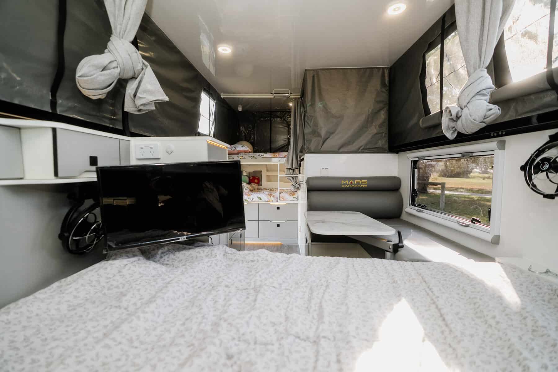 Mars 15 Elite Low down offroad hybrid caravan interior bed view of living space