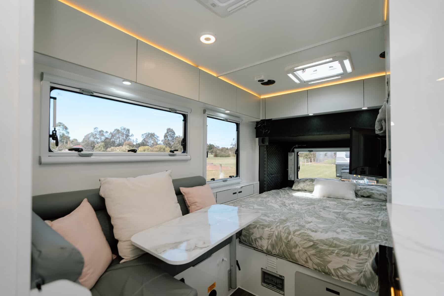 Mars 15 elite triple bunk hard roof offroad family caravan interior king sized bed and lounge