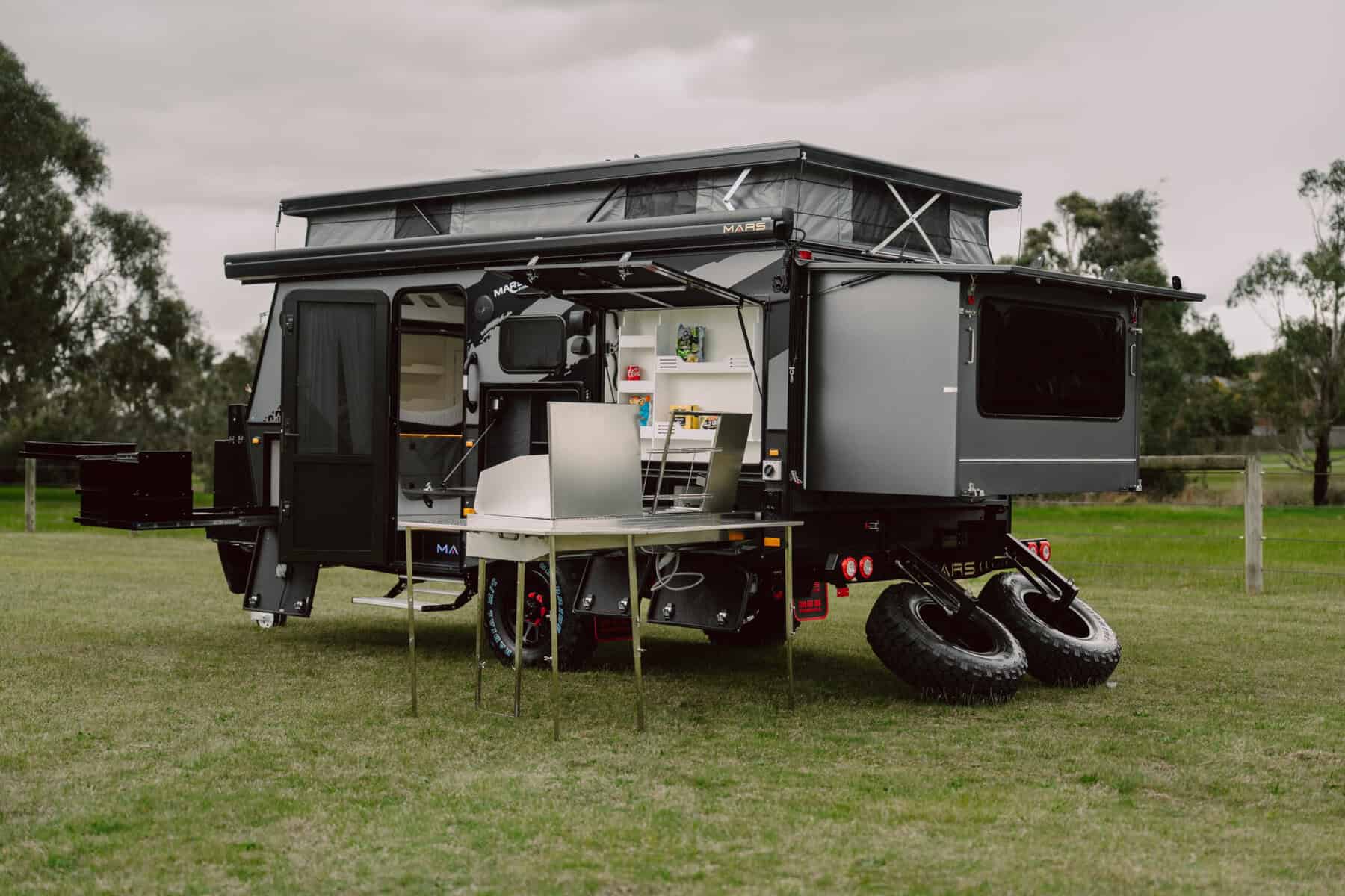 7. Mars 13 Elite offroad family caravan exterior rear angled view fully opened