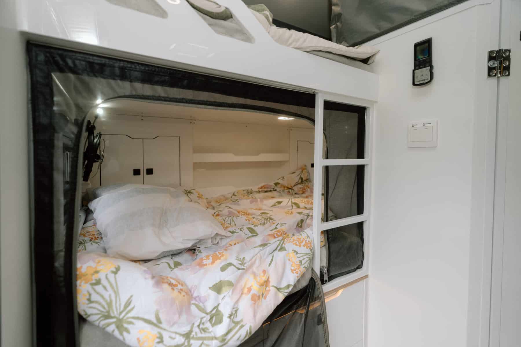 7. Mars 13 Elite offroad family caravan interior king single bunks with childproof netting