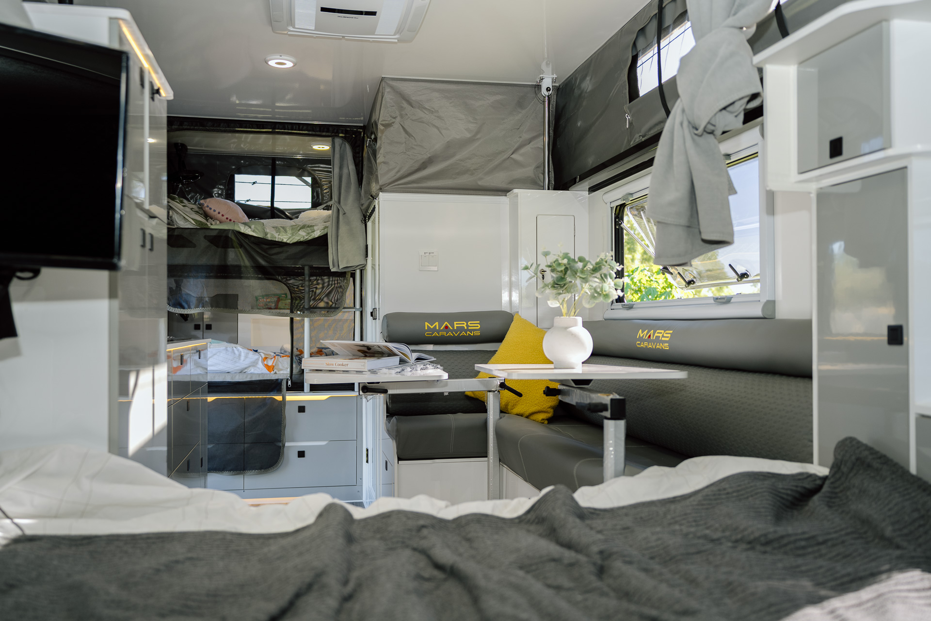 Mars 18 Elite family offroad hybrid pop top caravan close up view of interior lounge and bunk bed