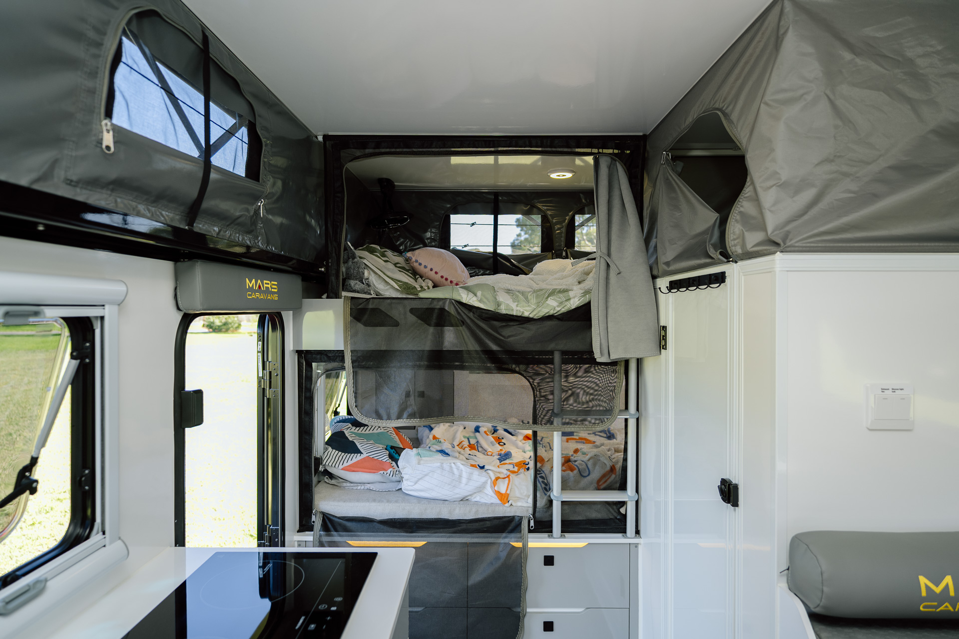 Mars 18 Elite 18 ft family offroad hybrid pop top caravan interior double bunk and cooktop